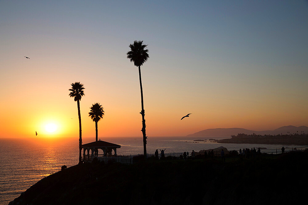 Pavilion and palm trees looking out to sea at sunset, Pismo Beach, San Luis Obispo County, California, United States of America, North America