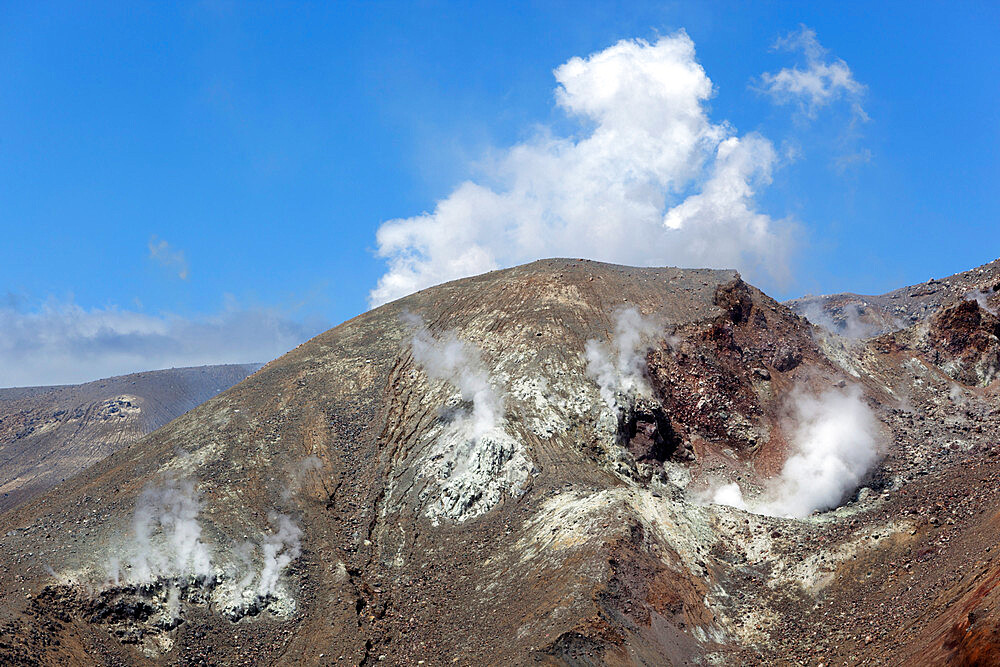 Steam rising from side of Mount Tongariro, Tongariro National Park, UNESCO World Heritage Site, North Island, New Zealand, Pacific