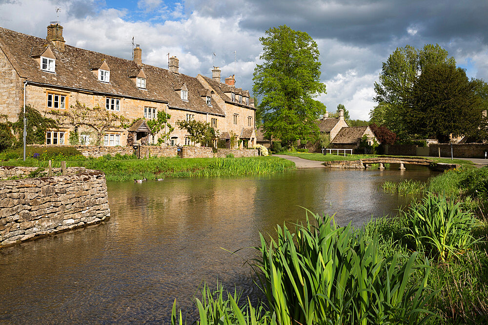 Cotswold stone cottages on the River Eye, Lower Slaughter, Cotswolds, Gloucestershire, England, United Kingdom, Europe