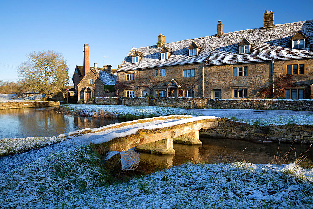 Stone bridge and Cotswold cottages in snow, Lower Slaughter, Cotswolds, Gloucestershire, England, United Kingdom, Europe