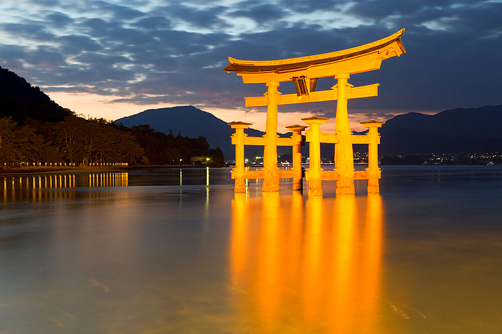 The floating Miyajima torii gate of Itsukushima Shrine at dusk, UNESCO World Heritage Site, Miyajima Island, Western Honshu, Japan, Asia