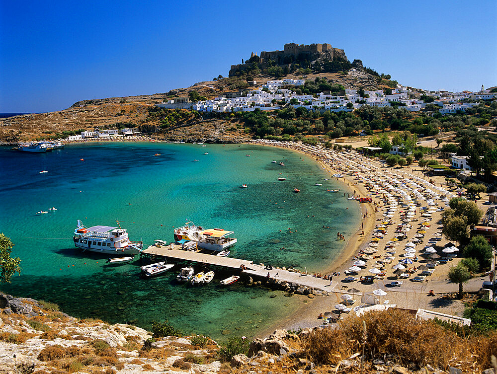 View over beach and castle, Lindos, Rhodes Island, Dodecanese Islands, Greek Islands, Greece, Europe