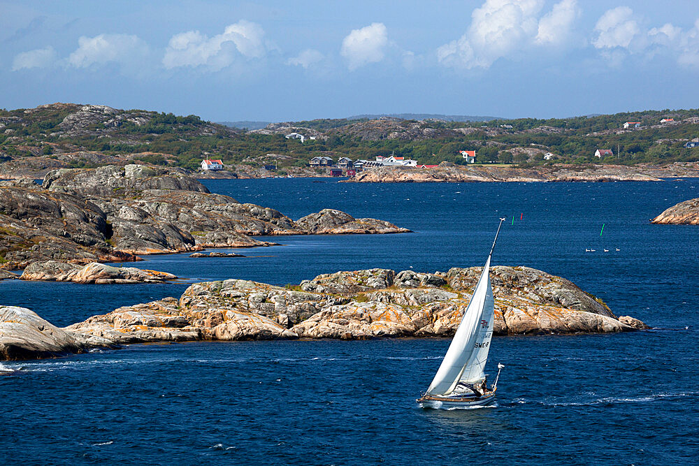 Yacht sailing through islands of archipelago, Skarhamn, Tjorn, Bohuslan Coast, southwest Sweden, Sweden, Scandinavia, Europe