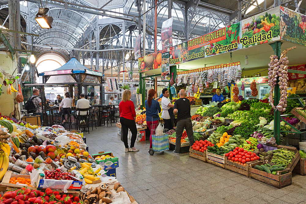 Fruit and vegetable stalls inside wrought iron interior of Mercado de San Telmo, Buenos Aires, Argentina, South America