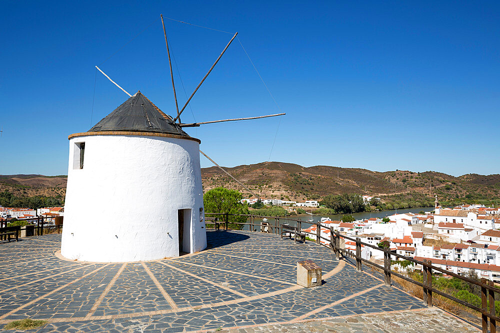 Windmill above village and Rio Guadiana river with view to Portugal, Sanlucar de Guadiana, Huelva Province, Andalucia, Spain, Europe