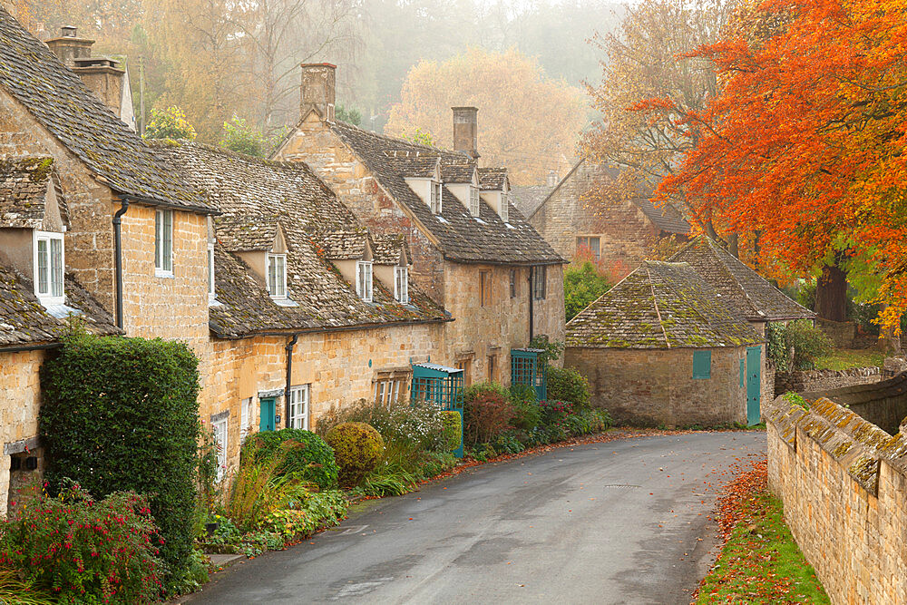 Line of Cotswold stone cottages in autumn mist, Snowshill, Cotswolds, Gloucestershire, England, United Kingdom, Europe