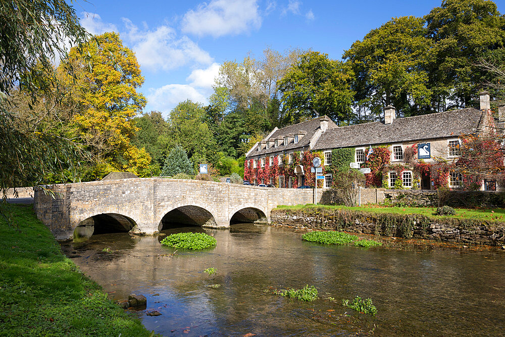 River Coln and The Swan Hotel in autumn, Bibury, Cotswolds, Gloucestershire, England, United Kingdom, Europe