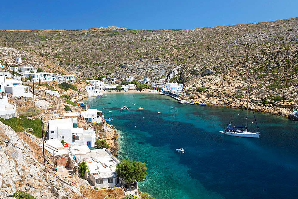 View over crystal clear water and fishing boats in harbour, Cheronissos, Sifnos, Cyclades, Aegean Sea, Greek Islands, Greece, Europe