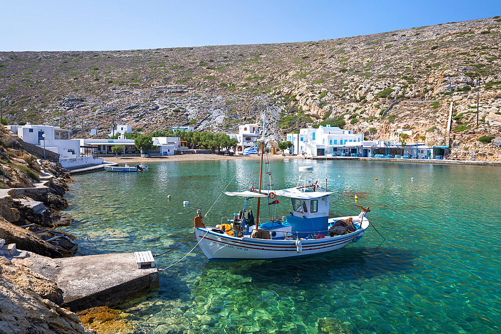 View over crystal clear water and fishing boats in harbour, Cheronissos, Sifnos, Cyclades, Aegean Sea, Greek Islands, Greece, Europe