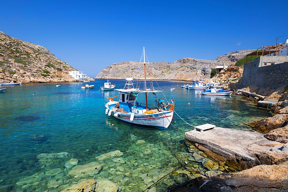 View of crystal clear water and fishing boats in harbour, Cheronissos, Sifnos, Cyclades, Aegean Sea, Greek Islands, Greece, Europe