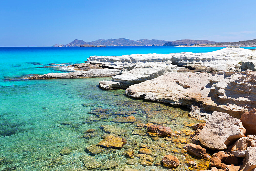 Clear turquoise sea and volcanic rock formations at Sarakiniko, Sarakiniko, Milos, Cyclades, Aegean Sea, Greek Islands, Greece, Europe