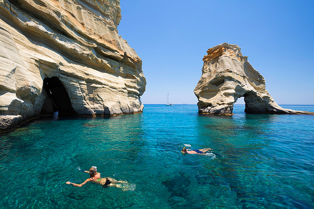 Snorkellers amongst rock formations with crystal clear water, Kleftiko, Milos, Cyclades, Aegean Sea, Greek Islands, Greece, Europe