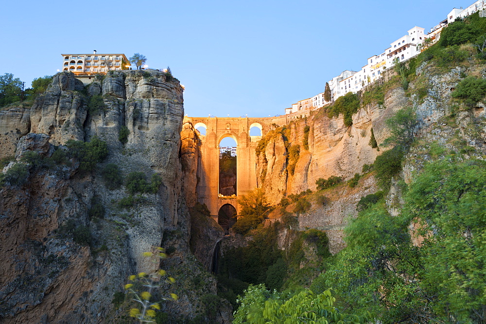 Puente Nuevo (New Bridge) floodlit at night and the white town perched on cliffs, Ronda, Andalucia, Spain, Europe