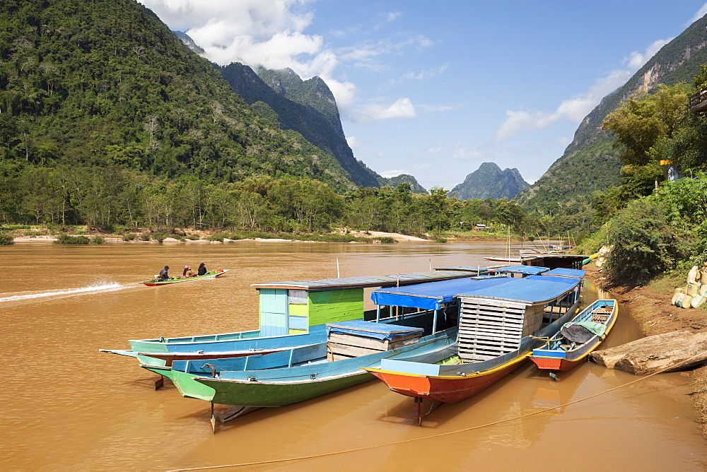 Boats docked on the Nam Ou River at Muang Ngoi Neua looking north, Luang Prabang Province, Northern Laos, Laos, Indochina, Southeast Asia, Asia