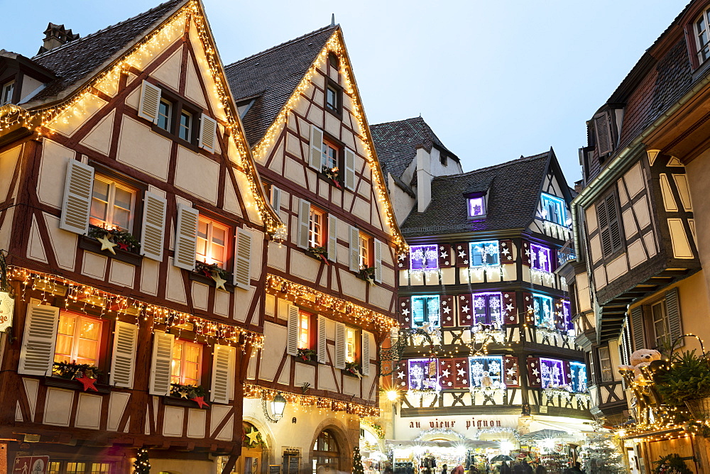 Half-timbered old buildings illuminated with Christmas decorations along the Rue des Marchands, Colmar, Alsace, France, Europe