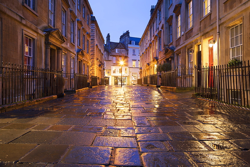 Wet paving stones and Georgian houses along the North Parade buildings, Bath, UNESCO World Heritage Site, Somerset, England, United Kingdom, Europe