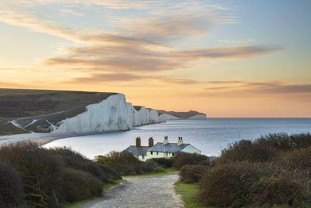 Seven Sisters and Beachy Head with coastguard cottages at sunrise in spring, Seaford Head, East Sussex, England, United Kingdom, Europe