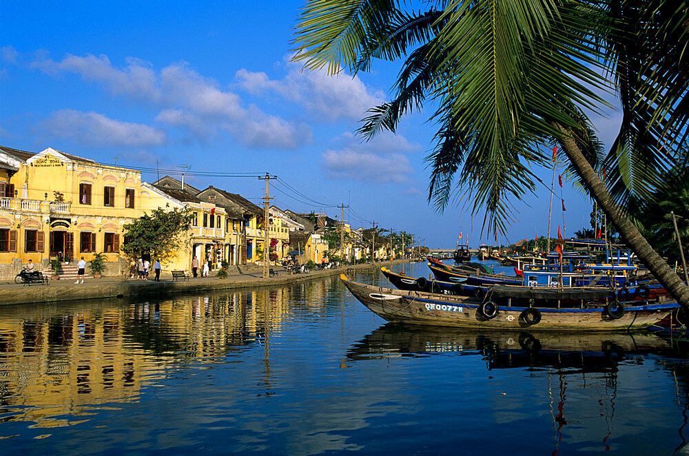 View of old town and fishing boats along Thu Bon River, Hoi An, UNESCO World Heritage Site, South Central Coast, Vietnam, Indochina, Southeast Asia, Asia