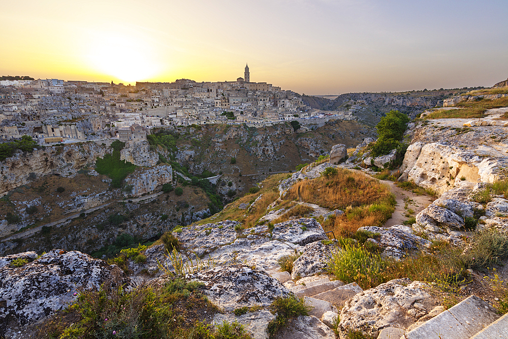 Sunset over Gravina River canyon to the Sassi di Matera old town, Matera, Basilicata, Italy, Europe