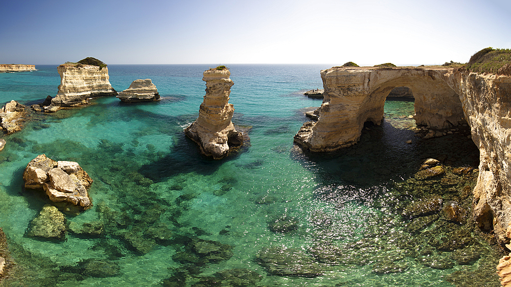 Rock stacks and crystal clear sea of the Faraglioni di Sant Andrea, Torre di Sant Andrea, Melendugno, Lecce Province, Puglia, Italy, Europe