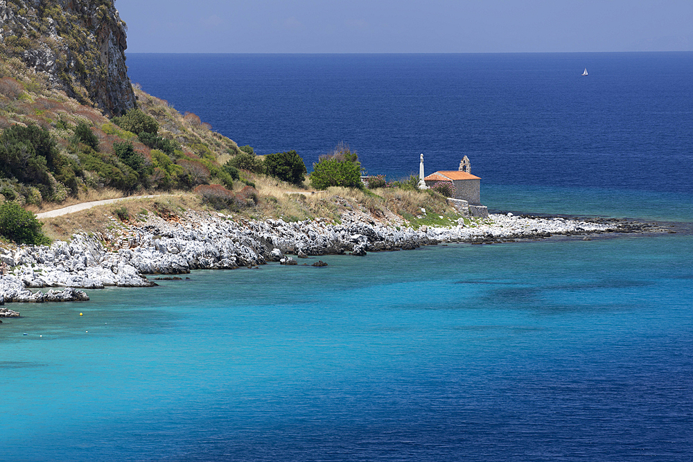 Chapel on headland with turquoise water, Limeni, Mani, Peloponnese, Greece, Europe