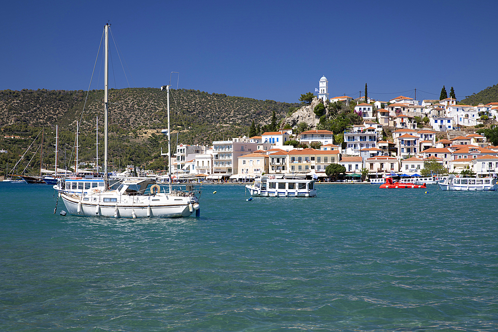 View of Poros town and clock tower from Galatas, Poros, Saronic islands, Greek Islands, Greece, Europe