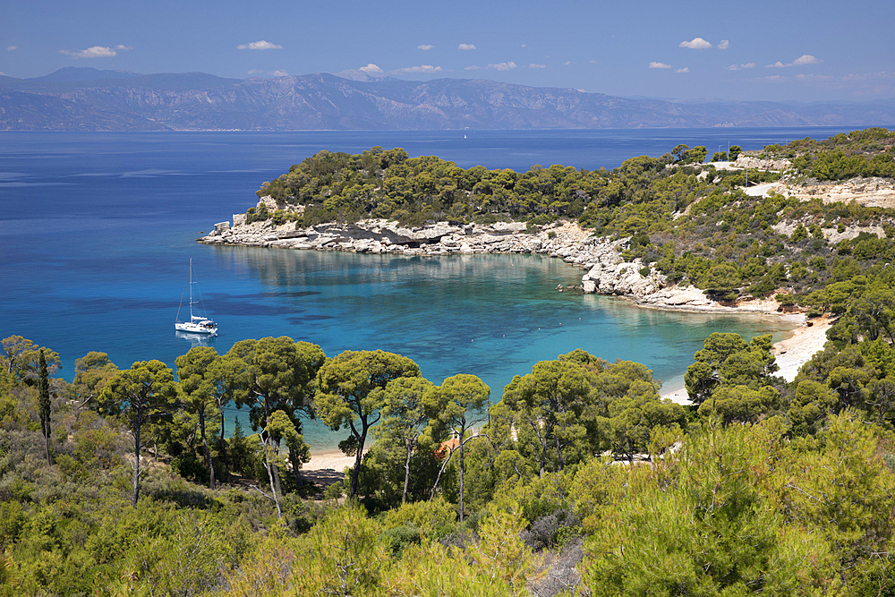 Agia Paraskevi beach with yacht anchored in bay, Spetses, Saronic Islands, Greek Islands, Greece, Europe