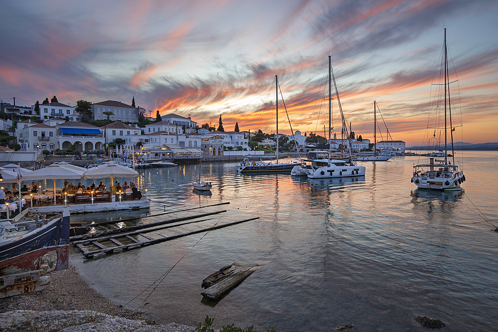 Palio Limani old harbour in Spetses town at sunset with yachts and restaurants, Spetses, Saronic Islands, Greek Islands, Greece, Europe