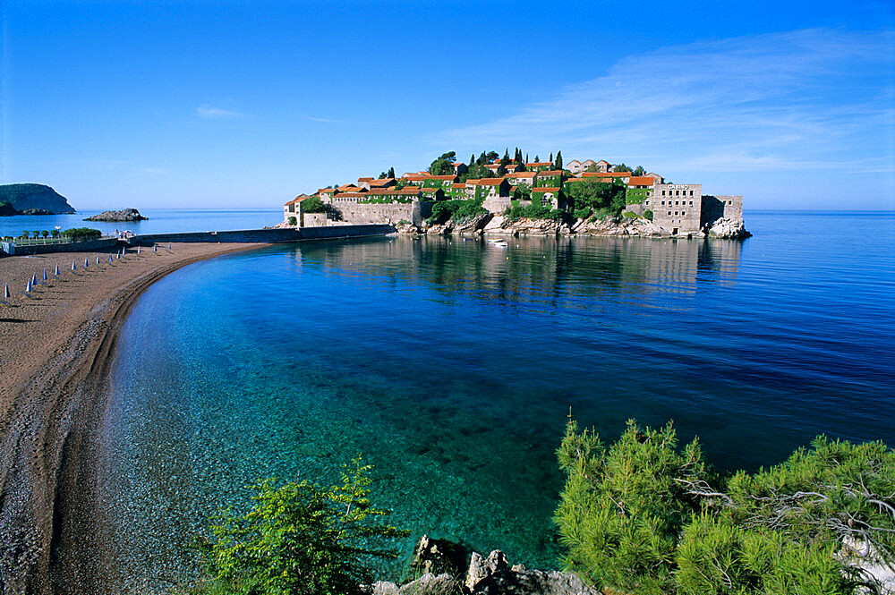 View of island and beach, Sveti Stefan, The Budva Riviera, Montenegro, Europe