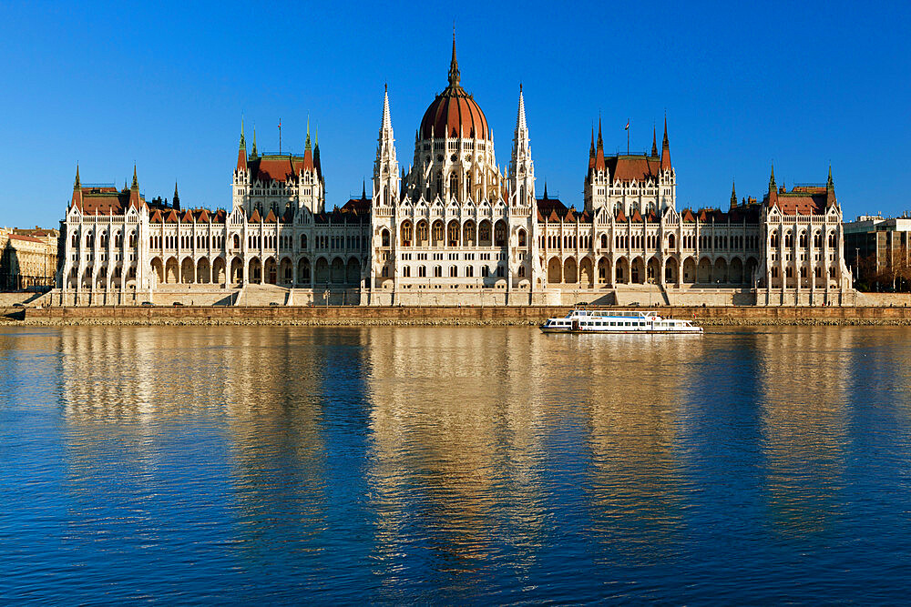 The Parliament (Orszaghaz) across River Danube at sunset, UNESCO World Heritage Site, Budapest, Hungary, Europe