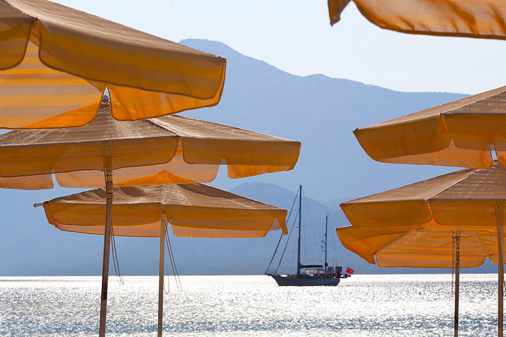 Umbrellas and yacht, Psili Ammos, Samos, Aegean Islands, Greece