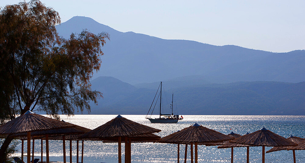 Umbrellas and yacht, Psili Ammos, Samos, Aegean Islands, Greece