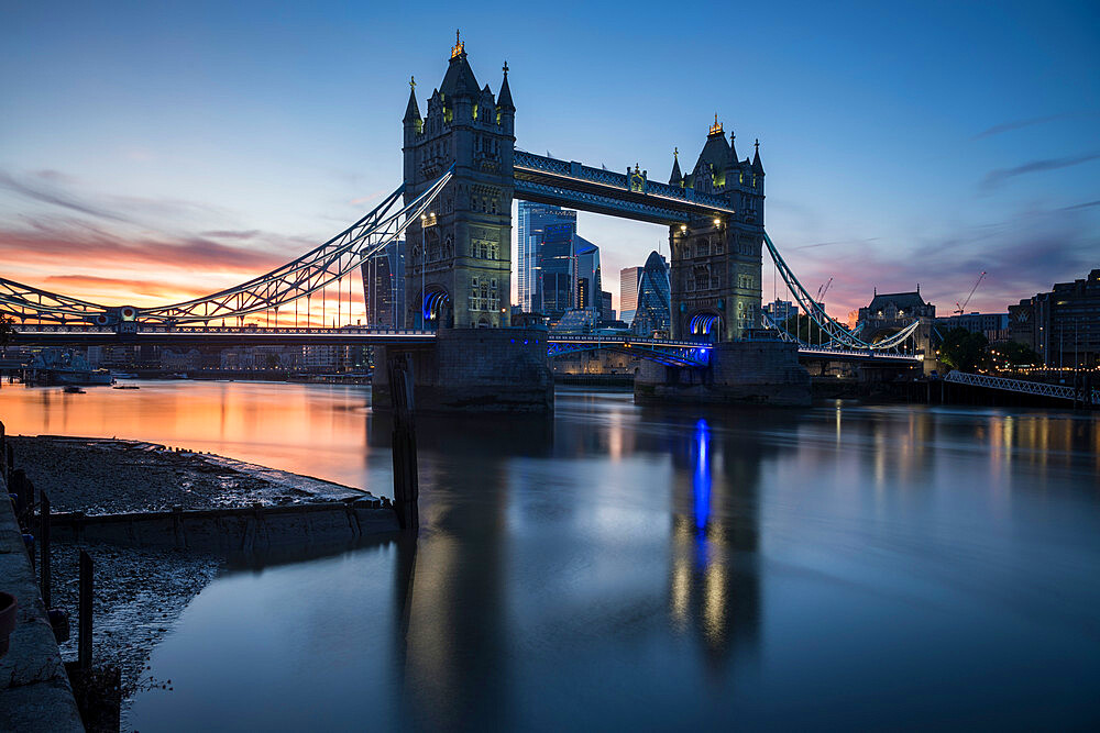 Tower Bridge at sunset reflected in the River Thames, London, England, United Kingdom, Europe