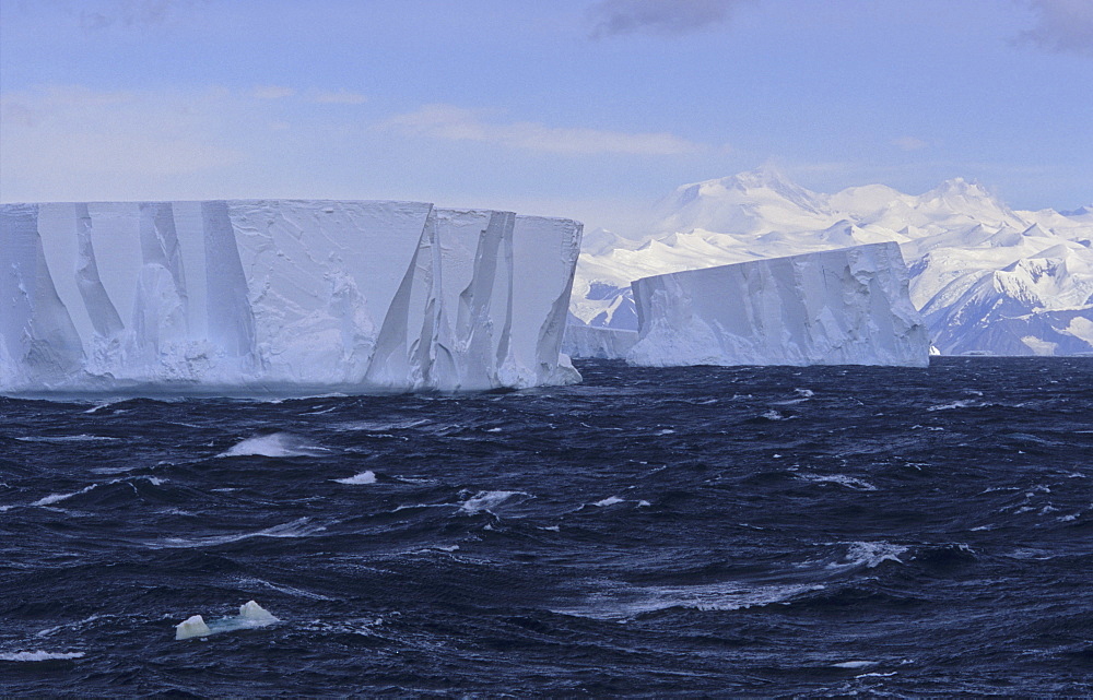 Tabular icebergs with Admiralty Mountains Range in background. Nearby Cape Adare, Ross Sea, Antarctica