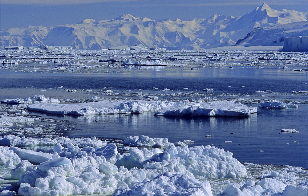 Open pack ice and Admiralty Mountains Range in background. Adare Peninsula, Ross Sea, Antarctica