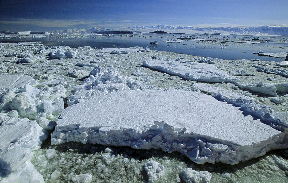 Pack ice and Admiralty Mountains Range in background. Adare Peninsula, Ross Sea, Antarctica