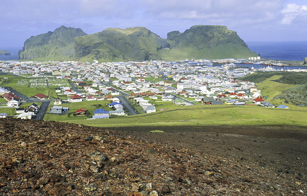 View from the Volcano Eldfell down to the settlement Heimaey. Vestmannaeyjar Islands, Southern Iceland