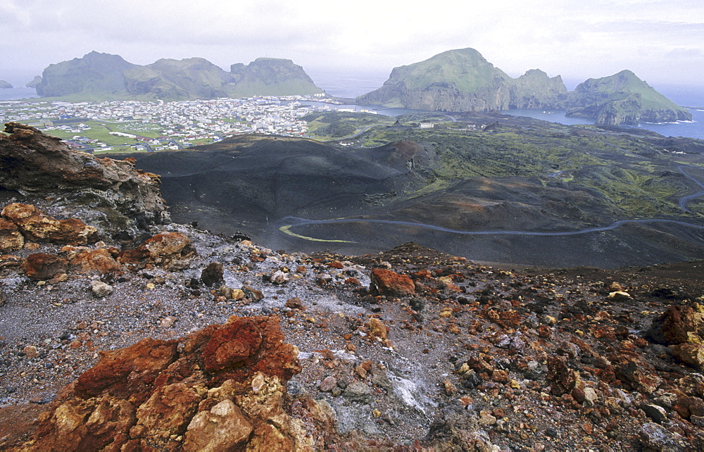 View from the Volcano Eldfell down to the settlement Heimaey. Vestmannaeyjar Islands, Southern Iceland