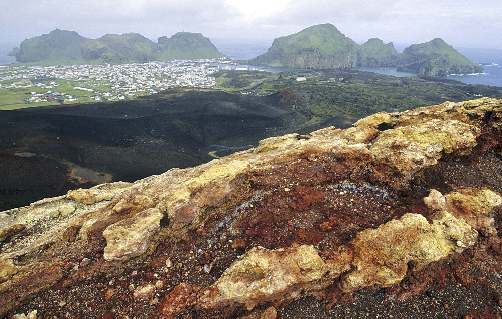 View from the Volcano Eldfell down to the settlement Heimaey. Vestmannaeyjar Islands, Southern Iceland