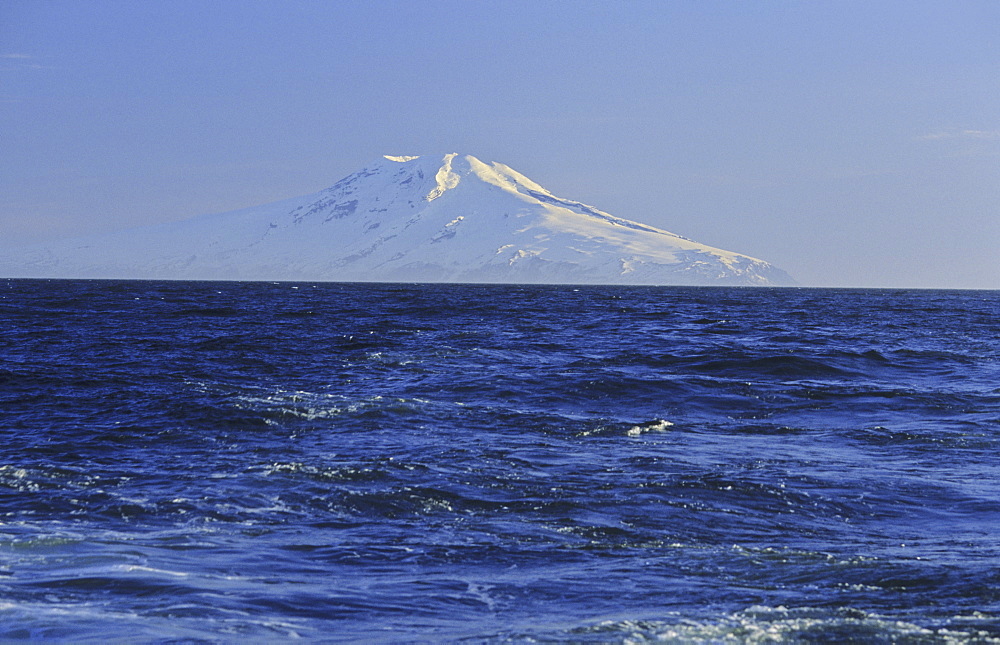 Summit of Mt Beerenberg, 2277m, seen from a long distance and the sea . Jan Mayen, North Atlantic Island