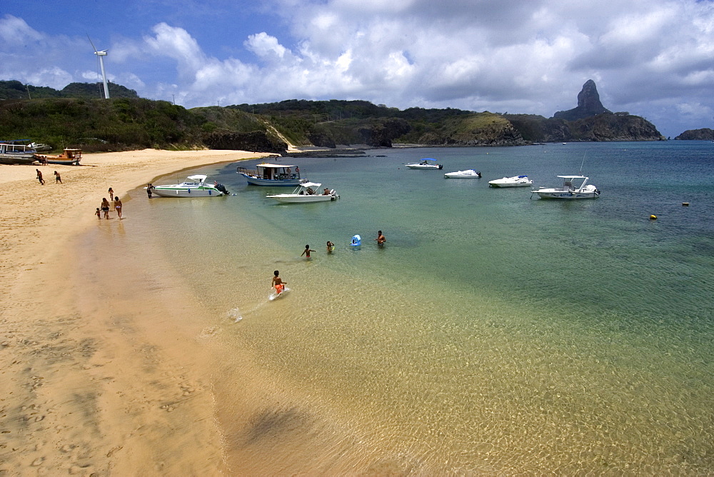 Kids playing at Praia do Porto, Fernando de Noronha, Pernambuco, Brazil, South America