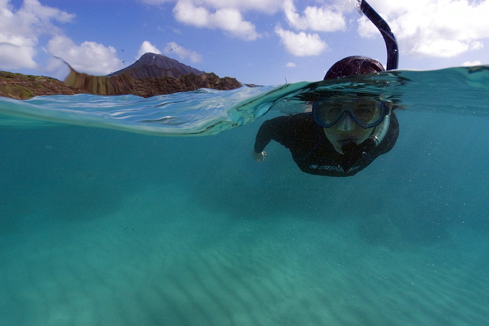 Split image of snorkeller hovering over sandy substrate, Hanauma Bay, Oahu, Hawaii, United States of America, Pacific