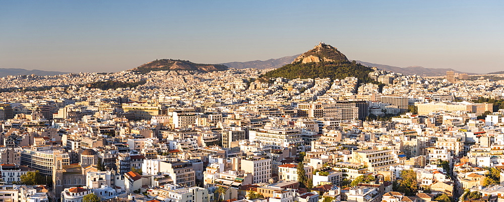 View of Athens and Likavitos Hill over the rooftops of the Plaka District from The Acropolis, Athens, Attica Region, Greece, Europe