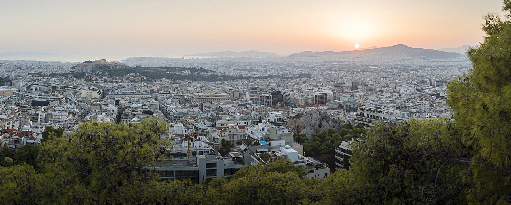 View over Athens and The Acropolis at sunset from Likavitos Hill, Athens, Attica Region, Greece, Europe