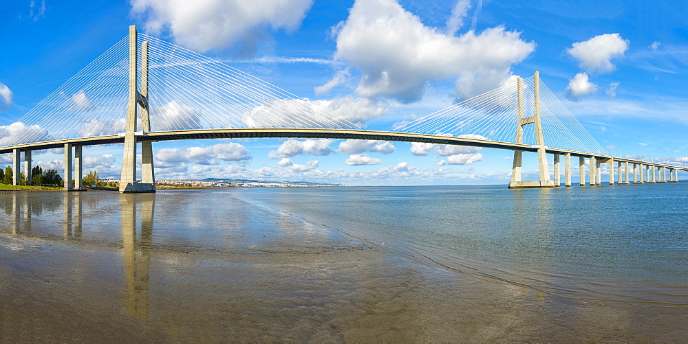 Vasco de Gama Bridge reflecting in the Tagus River, Lisbon, Portugal, Europe