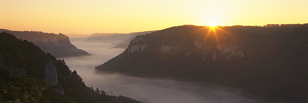 View from Eichfelsen Rock on Schloss Werenwag Castle and Danube Valley at sunrise, Upper Danube Nature Park, Swabian Alb, Baden Wurttemberg, Germany, Europe