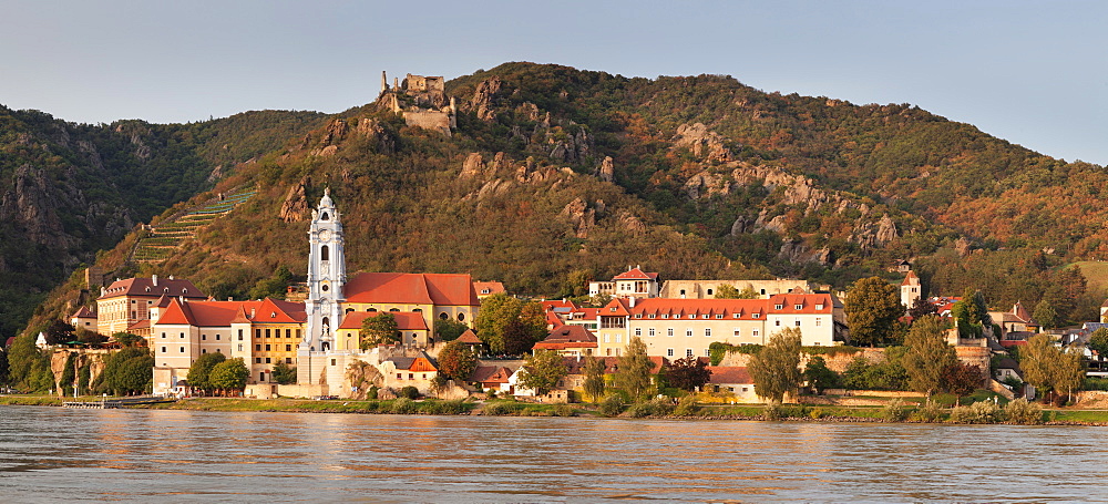 View over Danube River to Collegiate church and castle ruins, Durnstein, Wachau, Lower Austria, Austria, Europe