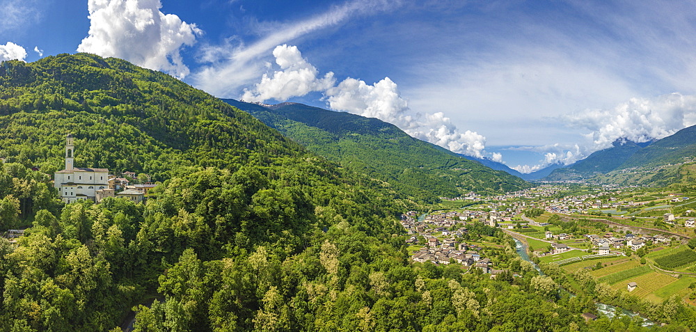 Aerial view of church and green hills around Sazzo, Ponte In Valtellina, Sondrio province, Lombardy, Italy, Europe