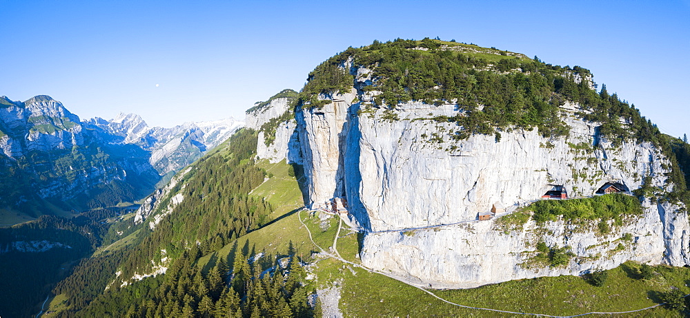 Aerial panoramic of Wildkirchli (Wild Chapel) and caves on rock face, Ebenalp, Appenzell Innerrhoden, Switzerland, Europe