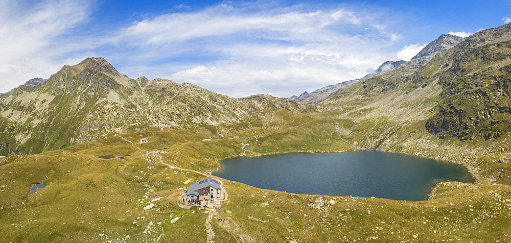 Aerial panoramic of Lake Emet, Rifugio Bertacchi and peak Emet, Spluga Valley, Sondrio province, Valtellina, Lombardy, Italy, Europe